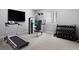 A well-equipped exercise room featuring a treadmill, weight machine, and dumbbell rack at 16069 Pikes Peak Dr, Broomfield, CO 80023
