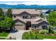 Charming two-story home featuring a well-manicured lawn and beautiful mountain views at 16069 Pikes Peak Dr, Broomfield, CO 80023