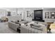 Spacious living room featuring neutral colored furniture, a fireplace, and built in shelves at 16069 Pikes Peak Dr, Broomfield, CO 80023