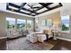 Large bedroom with trey ceilings, large windows and a sitting area at 16069 Pikes Peak Dr, Broomfield, CO 80023