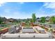 Relaxing outdoor patio features comfortable seating and a cozy fire pit, perfect for entertaining and enjoying the outdoors at 16069 Pikes Peak Dr, Broomfield, CO 80023