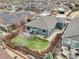 Aerial view of a home showcases a well-manicured lawn, a cozy patio, and a beautifully fenced backyard at 9139 Flora St, Arvada, CO 80005