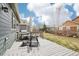 A charming back deck is complete with a barbeque, table, and chairs, perfect for entertaining or relaxing outdoors at 9139 Flora St, Arvada, CO 80005