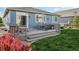 Inviting backyard with a well-maintained lawn and a spacious deck perfect for outdoor dining at 9139 Flora St, Arvada, CO 80005