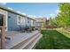 Inviting backyard with a well-maintained lawn and a spacious deck perfect for outdoor dining at 9139 Flora St, Arvada, CO 80005