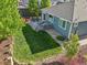 Aerial view of the backyard featuring a spacious deck and lush green lawn at 9139 Flora St, Arvada, CO 80005