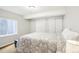 Comfortable bedroom with large window and closet space, providing natural light and ample storage at 9139 Flora St, Arvada, CO 80005