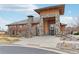 Beautiful community clubhouse with stone accents, professionally landscaped grounds, and a welcoming entrance at 9139 Flora St, Arvada, CO 80005