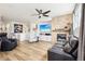 Spacious living room with fireplace, ceiling fan and hardwood floors at 9139 Flora St, Arvada, CO 80005