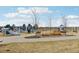 Well-maintained playground with multiple play structures, swings, and soft landing surfaces for active fun and safety at 9139 Flora St, Arvada, CO 80005