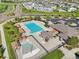 Aerial view of a sparkling blue pool surrounded by lounge areas and manicured landscaping in a community at 9139 Flora St, Arvada, CO 80005