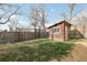 Backyard featuring a red shed and fencing at 1540 E 95Th Ave, Thornton, CO 80229