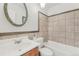 Cozy bathroom showcasing a tiled shower and a vanity sink at 1540 E 95Th Ave, Thornton, CO 80229