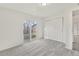 This bedroom features a sliding glass door and a closet with white doors at 1540 E 95Th Ave, Thornton, CO 80229