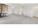 Spacious living room with a stone fireplace, neutral carpet, and ample natural light at 1540 E 95Th Ave, Thornton, CO 80229