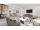 Bright living room with a stone fireplace, modern furnishings, and an open floor plan at 1540 E 95Th Ave, Thornton, CO 80229