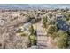 Aerial view of road, homes, and park with snowy landscape at 1155 S Harlan St, Lakewood, CO 80232