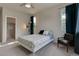 Well-lit bedroom featuring a ceiling fan, a cozy chair, and two large windows providing natural light at 1310 Hoyt St # 6, Lakewood, CO 80215