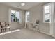 Versatile bedroom with a ceiling fan, three large windows, and ample space for a desk or seating area at 1310 Hoyt St # 6, Lakewood, CO 80215