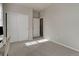 Bright bedroom featuring neutral walls, carpet, a closet, and ample natural light at 1310 Hoyt St # 6, Lakewood, CO 80215