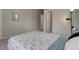 Spacious bedroom featuring neutral walls, carpet floors, and an adjoining closet and doorway at 1310 Hoyt St # 6, Lakewood, CO 80215