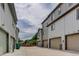 Exterior view of garages with addresses and green landscape at 1310 Hoyt St # 6, Lakewood, CO 80215