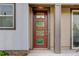 Inviting front entrance featuring a decorative glass door and prominent house number for easy identification at 1310 Hoyt St # 6, Lakewood, CO 80215
