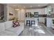 Open-concept living area with a modern kitchen, dining area, and comfortable seating at 1310 Hoyt St # 6, Lakewood, CO 80215