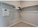 Organized walk-in closet featuring shelving and hanging space for clothing storage at 1310 Hoyt St # 6, Lakewood, CO 80215