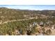 An aerial view of a home in a densely wooded mountain community at 28539 Douglas Park Rd, Evergreen, CO 80439