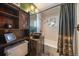 Modern bathroom with stylish vanity, vessel sink, and a tub with shower at 28539 Douglas Park Rd, Evergreen, CO 80439