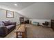 Versatile bonus room with cozy seating area at 28539 Douglas Park Rd, Evergreen, CO 80439