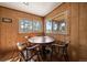 Bright breakfast nook with wooded views at 28539 Douglas Park Rd, Evergreen, CO 80439