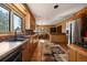 Open kitchen with custom wood cabinets, stainless steel appliances, and backyard view at 28539 Douglas Park Rd, Evergreen, CO 80439