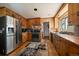 Charming kitchen with stainless steel appliances, wood countertops, and ample cabinet space at 28539 Douglas Park Rd, Evergreen, CO 80439