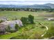 Scenic aerial view of the neighborhood, set against a backdrop of rolling green hills and distant mountain peaks at 9467 W Plymouth Ave, Littleton, CO 80128
