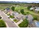 An aerial view showing the house with green space and mountain views in the background at 9467 W Plymouth Ave, Littleton, CO 80128
