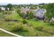 Picturesque view showcasing the property surrounded by green space, walking trails, and nearby homes at 9467 W Plymouth Ave, Littleton, CO 80128