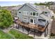 Expansive back deck with outdoor seating and a well-maintained patio for relaxing and entertaining guests at 9467 W Plymouth Ave, Littleton, CO 80128