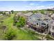 Exterior view showcasing an elevated deck, a well-manicured yard, and picturesque surroundings at 9467 W Plymouth Ave, Littleton, CO 80128