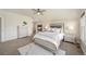 An elegantly appointed bedroom with a fireplace, soft carpeting, and a large well-lit mirror at 9467 W Plymouth Ave, Littleton, CO 80128