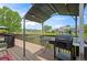 Outdoor deck with a built-in grill and scenic views, perfect for entertaining at 9467 W Plymouth Ave, Littleton, CO 80128