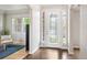 Bright foyer featuring a decorative glass front door and sidelights, opening to the living spaces at 9467 W Plymouth Ave, Littleton, CO 80128