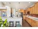 Open kitchen featuring a large island, stainless appliances, and hardwood flooring at 9467 W Plymouth Ave, Littleton, CO 80128
