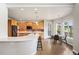 Well-lit kitchen with wood cabinets, stainless steel appliances, and breakfast nook at 9467 W Plymouth Ave, Littleton, CO 80128