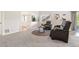 Cozy living room with plush carpet, modern furniture, and ample natural light at 9467 W Plymouth Ave, Littleton, CO 80128
