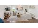 Comfortable living room with a large area rug, television, and stylish furnishings at 9467 W Plymouth Ave, Littleton, CO 80128