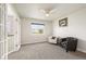 This living room is accentuated with soft carpeting, French doors, and natural light at 9467 W Plymouth Ave, Littleton, CO 80128