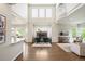 Spacious living area with a fireplace, soaring ceilings, and large windows at 9467 W Plymouth Ave, Littleton, CO 80128