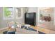 Comfortable sitting area with view into dining room and equipped with built in storage at 9467 W Plymouth Ave, Littleton, CO 80128